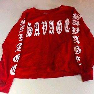 A red savage long sleeve shirt